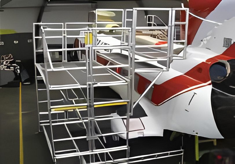 Metal boarding stairs positioned next to an airplane door.