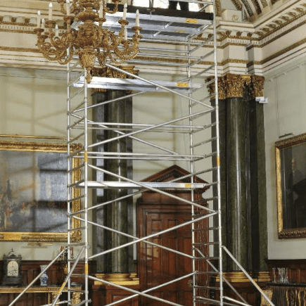 Scaffolding set up inside an ornate room for restoration work.